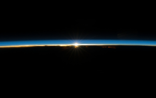 Sun peaking over the edge of the earth